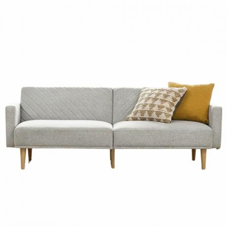 Pilka futoninė sofa su geltonomis pagalvėmis
