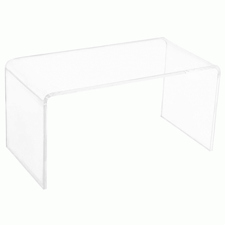 Et gennemsigtigt akryl sofabord med afrundede hjørner