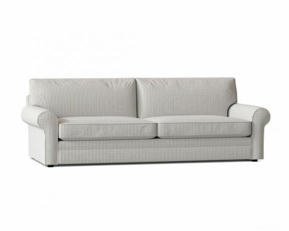 Un divano letto queen-size a righe grigie con braccioli a scorrimento