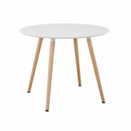 Runder Esstisch mit weißer Platte und kontrastierenden Holzbeinen