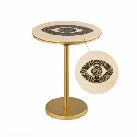 Ein goldener Nachttisch mit schwarzem Augendesign