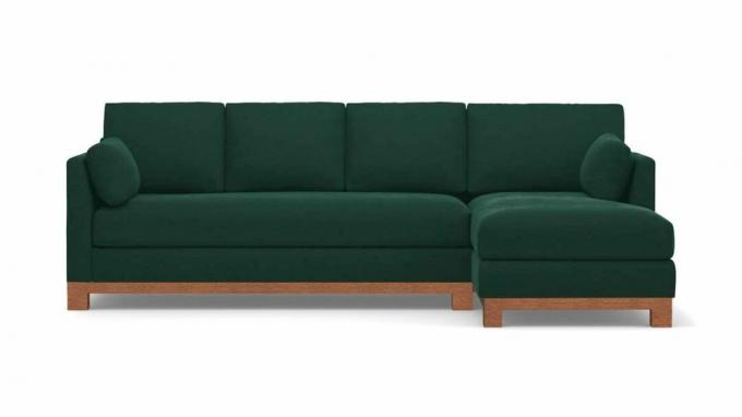 Un sofa sectionnel en velours vert