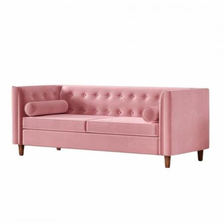 Un lungo divano rettangolare rosa 