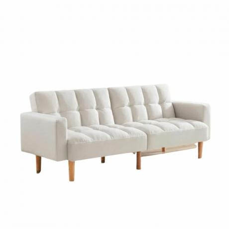 Un divano letto bianco con gambe in legno