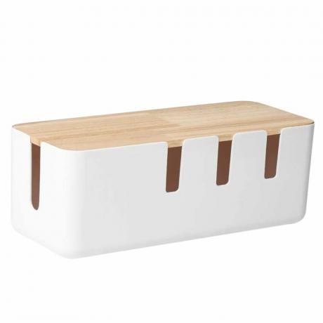 Ένα λευκό κουτί διαχείρισης καλωδίων με ξύλινο καπάκι