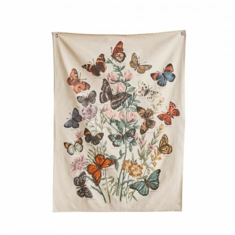 Ein Wandteppich mit vielen Schmetterlingen darauf