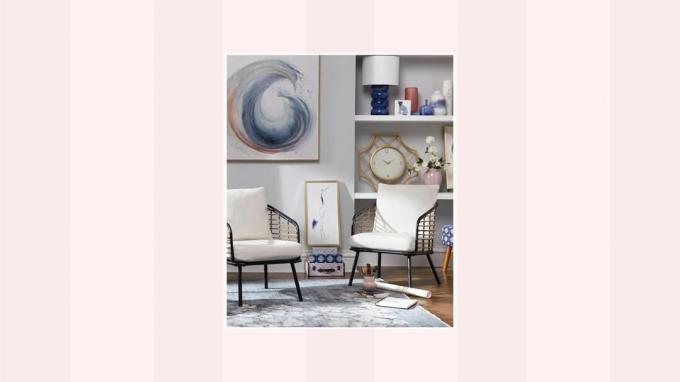 Una imagen de una sala de estar azul sobre un fondo rosa y blanco.