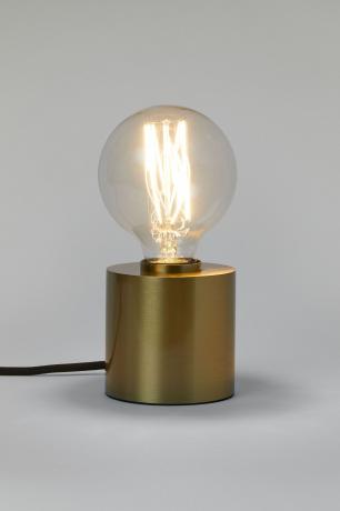 H&M Home piccola lampadina a vista in un supporto dorato