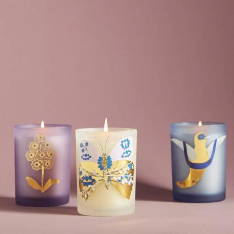 Trio de jolies bougies cadeaux assorties dans des pots votifs décoratifs