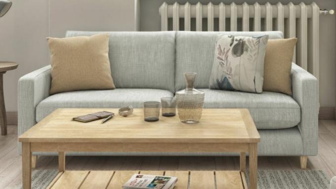 O canapea extensibilă gri într-un living modern
