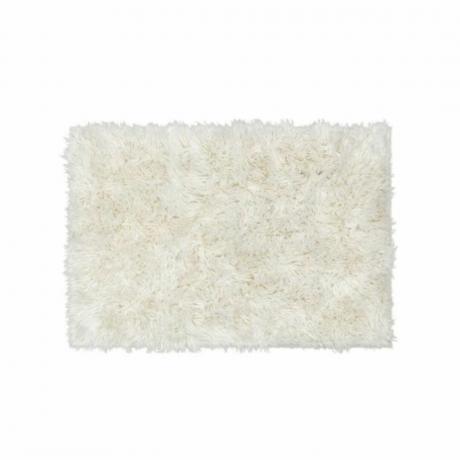 Et hvidt lodnet tæppe