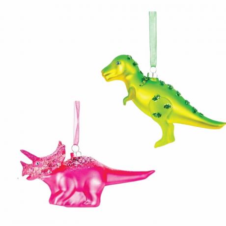 Dos adornos navideños de dinosaurios: uno rosa y otro verde.