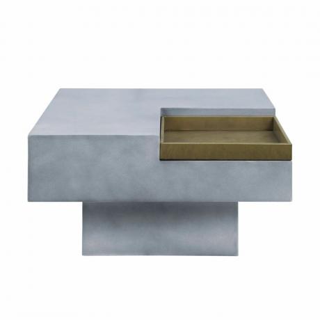 Une table basse carrée en béton gris