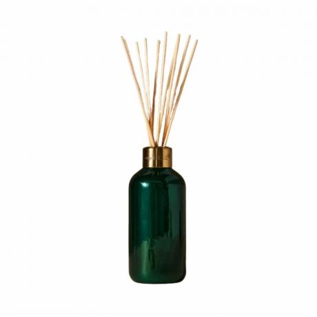Diffusore a bastoncini in abete blu e legna da ardere di Capri in una bottiglia verde